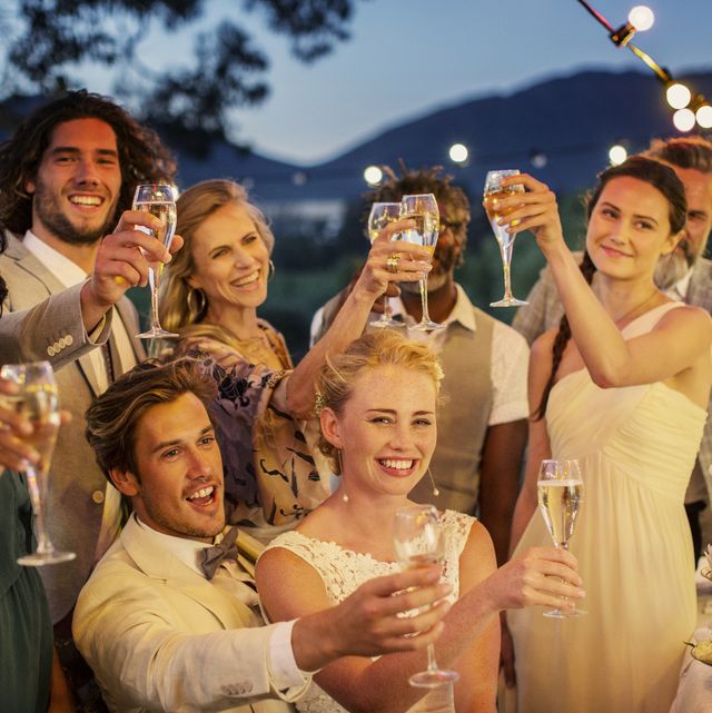 https://hips.hearstapps.com/hmg-prod/images/wedding-guests-toasting-with-champagne-during-royalty-free-image-544489931-1556731769.jpg?crop=0.613xw:0.870xh;0,0.0711xh&resize=640:*