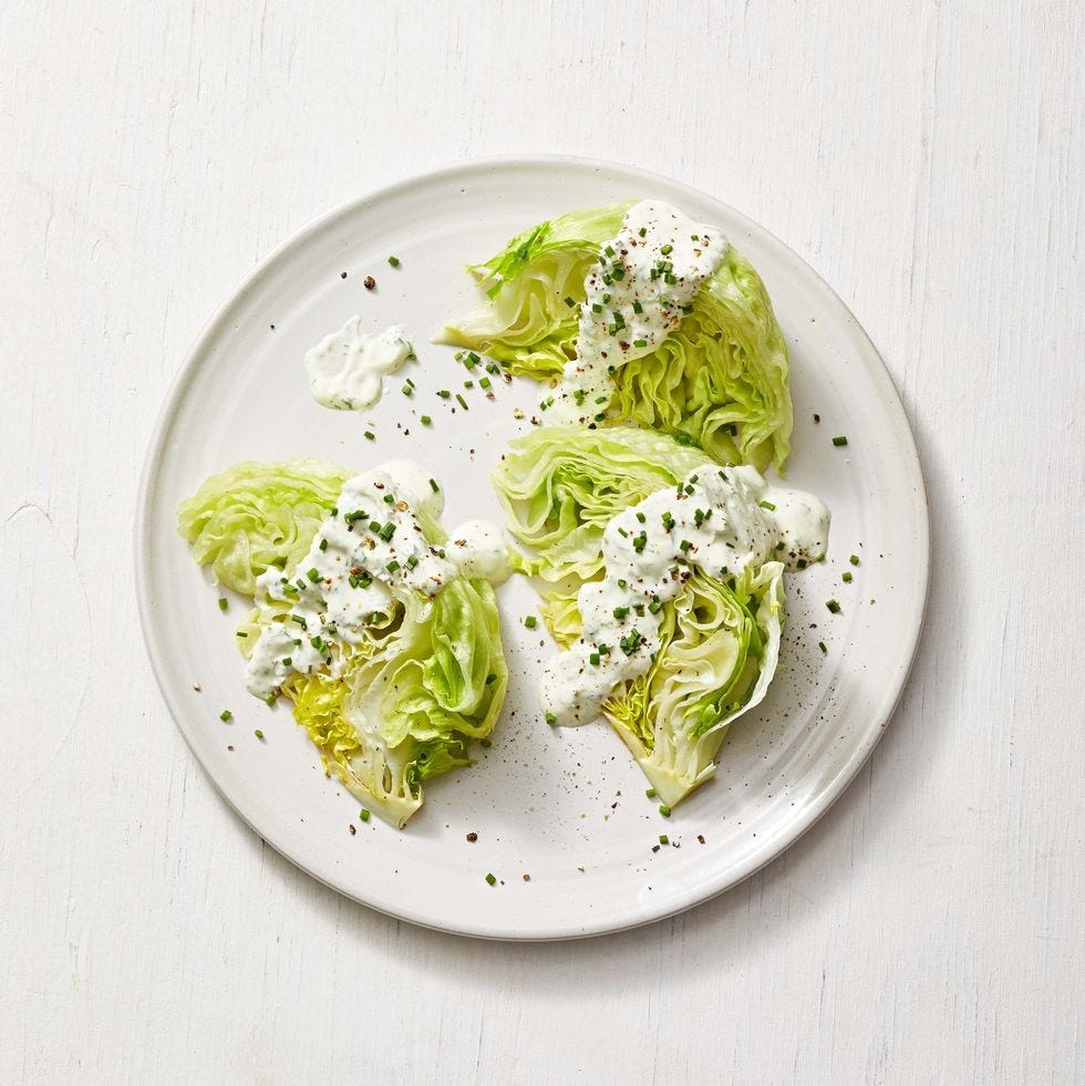 wedge salad with creamy herb dressing on top