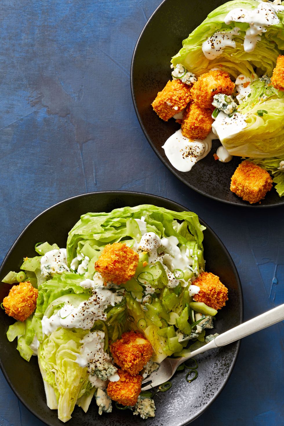 https://hips.hearstapps.com/hmg-prod/images/wedge-salads-with-buffalo-tofu-croutons-644ac3aa680df.jpg?crop=0.745xw:0.745xh;0.0990xw,0.0741xh&resize=980:*