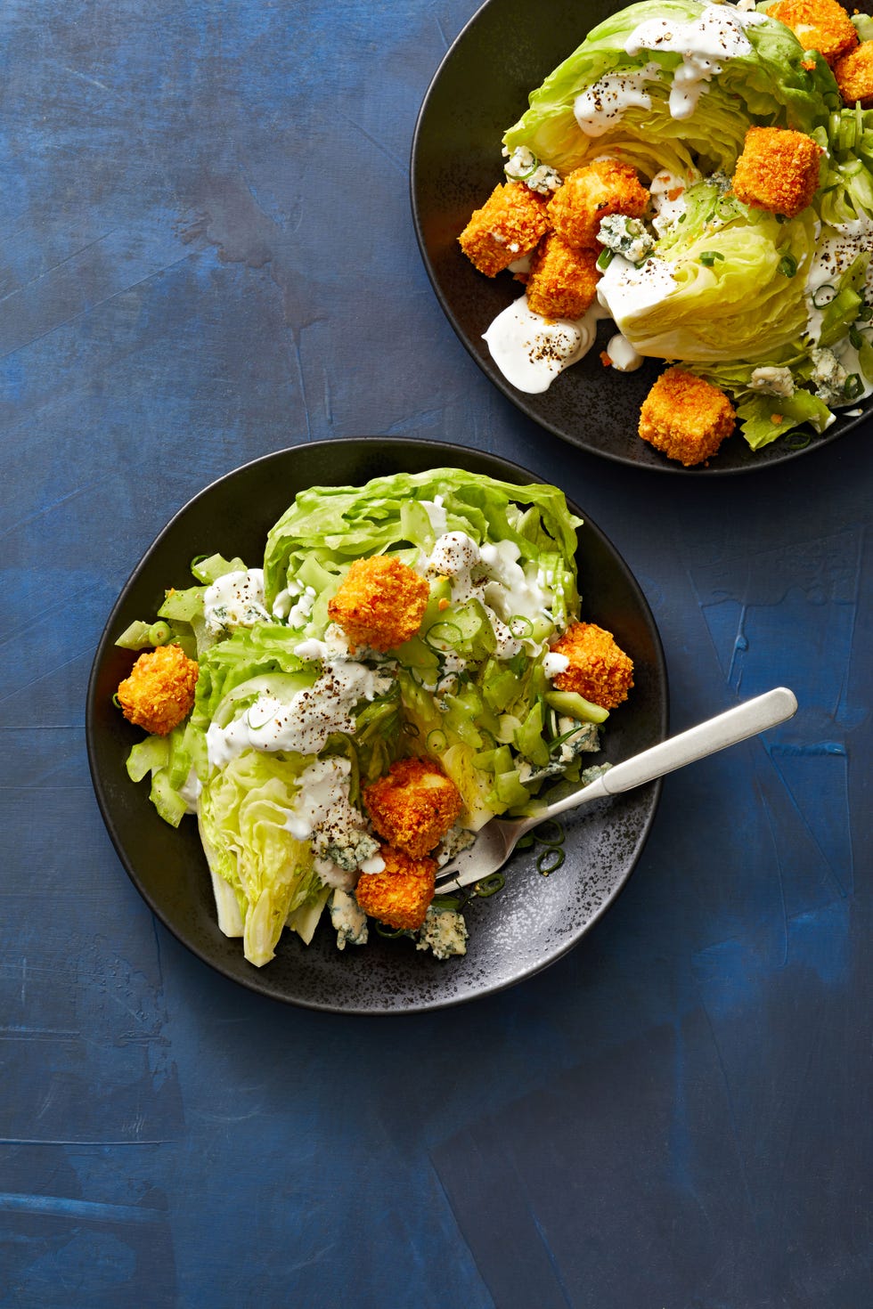 wedge salad with buffalo tofu croutons on top