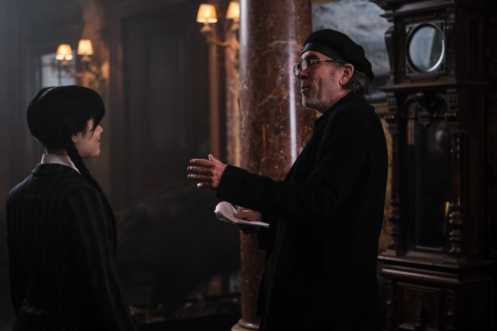 wednesday l to r jenna ortega as wednesday addams, director tim burton in wednesday cr tomasz lazarnetflix © 2022