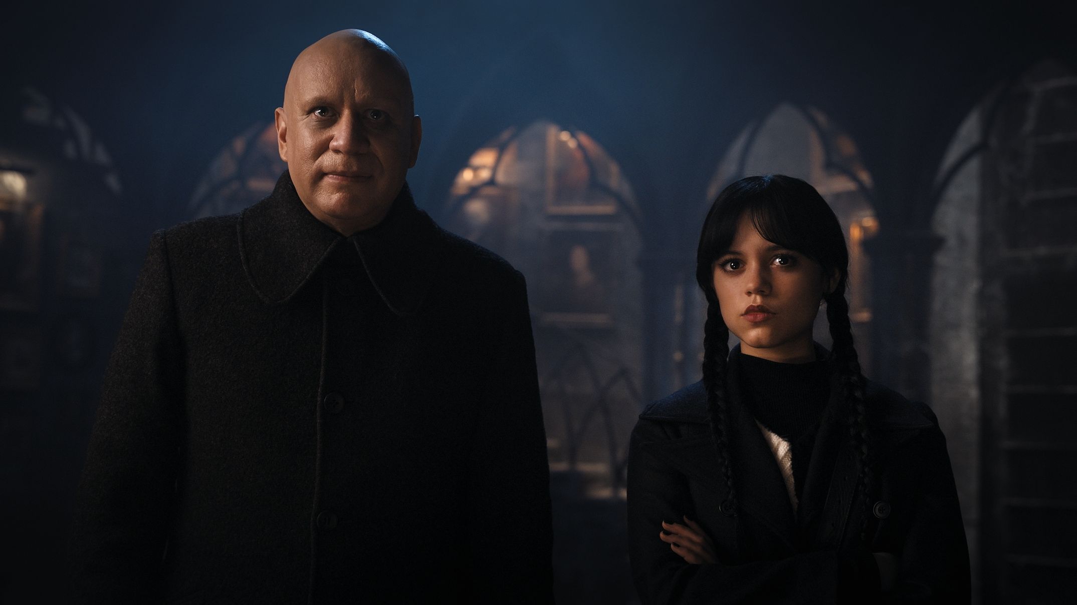 full body of a Wednesday Addams (Jenna Ortega) and uncle Fester