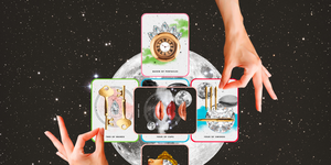 two hands are placed over a tarot card spread over a full moon