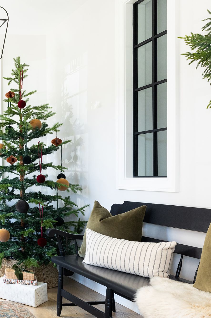 a living room with a christmas tree