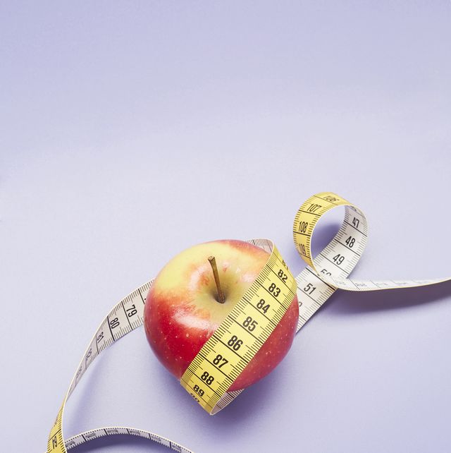 Lose weight concept. Bathroom scale, measuring tape, apples on