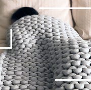 person sleeping under weighted knit blanket person sleeping under weighted knit blanket