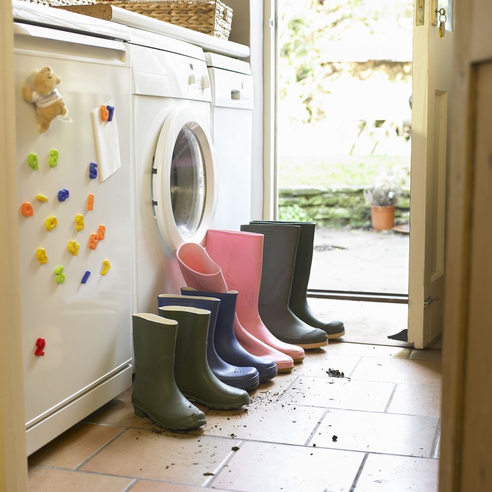 wellington boots lined up in utility room