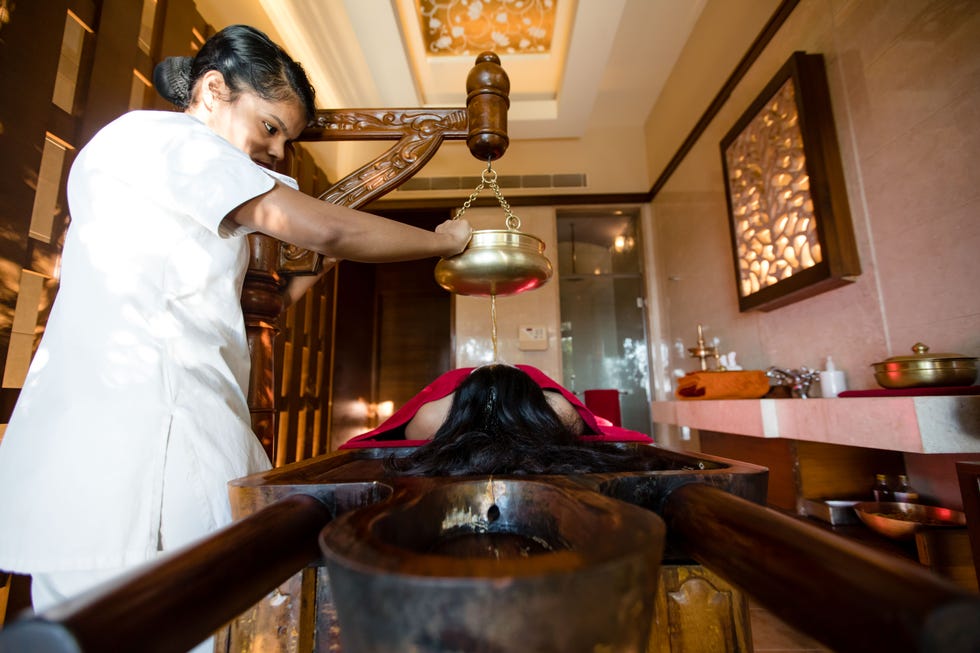 a therapeutic oil treatment session in a wellness center