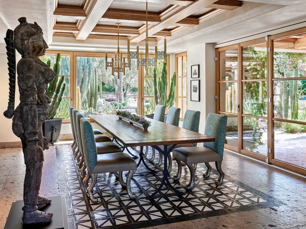 a dining room table with chairs