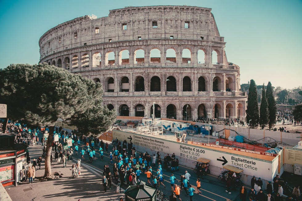 historic roman amphitheater with crowds ticket office and construction area