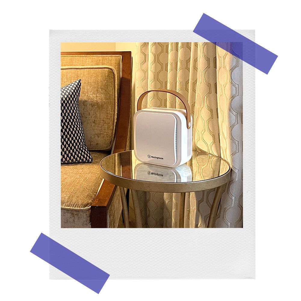 westinghouse air purifier on hotel room side table