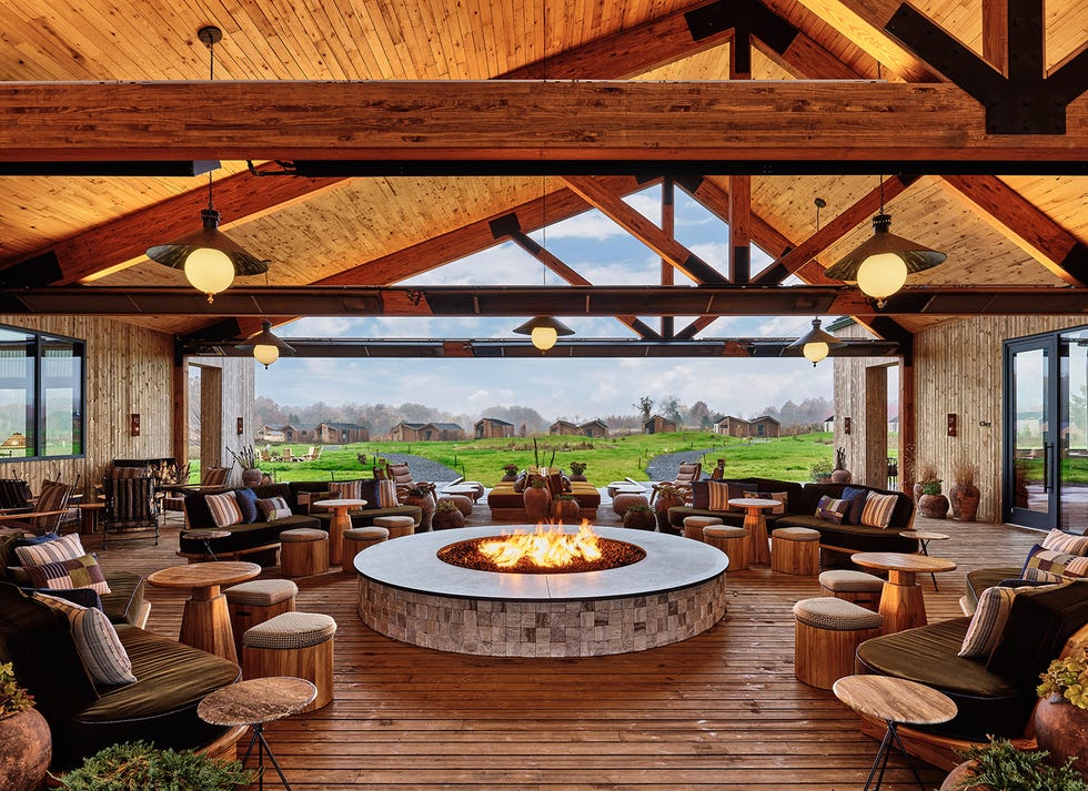 lounge area featuring a fire pit and comfortable seating with outdoor views