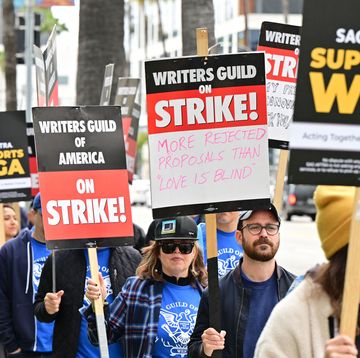writers on strike march with signs on the picket line on day four of the strike by the writers guild of america in front of netflix in hollywood, california on may 5, 2023 more than 11,000 hollywood television and movie writers are on their first strike since 2007 after talks with studios and streamers over pay and working conditions failed to clinch a deal photo by frederic j brown afp photo by frederic j brownafp via getty images
