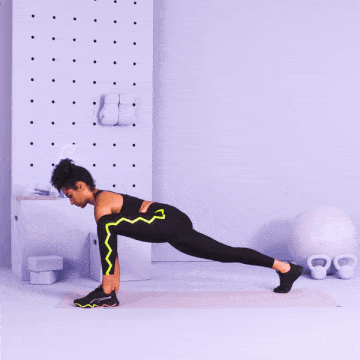 trainer performing low lunge with arm reach