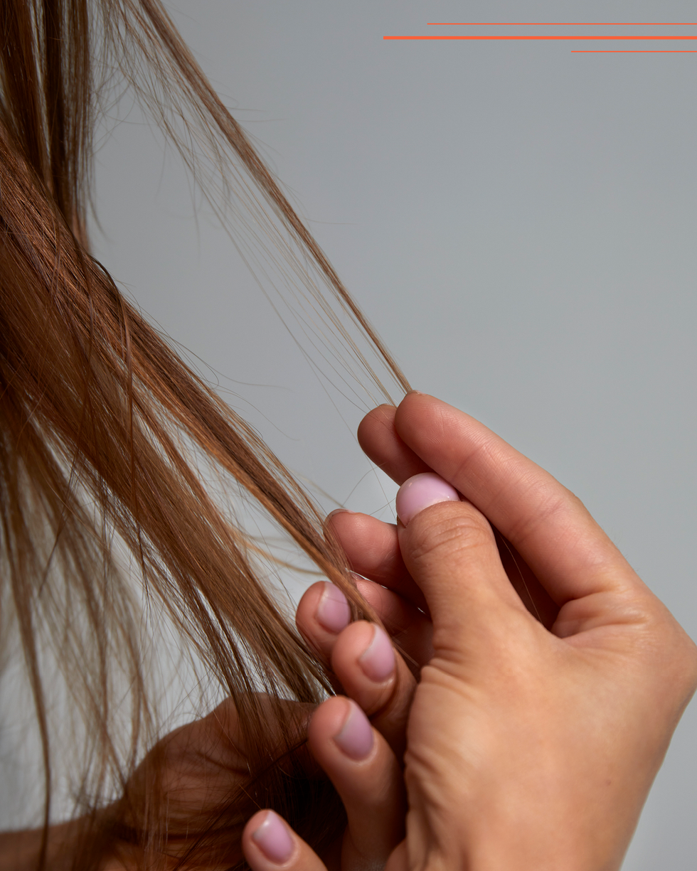 a woman holding this hair