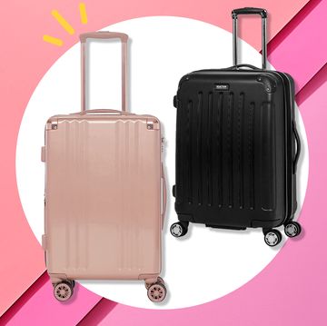 two suitcases one pink one and a black one, both hard shell