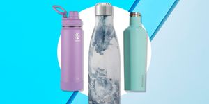 three reusable water bottles on a blue background