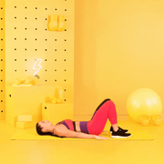 trainer Tatiana Lampa performing glute bridge trainer tatiana lampa performing glute bridge