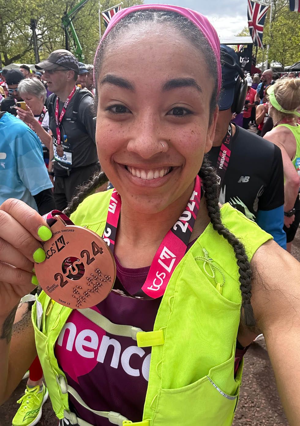 a woman holding a medal