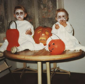 taken in 1984, two little boys dressed up as scary ghosts for halloween