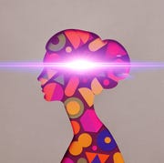 cutout of woman's silhouette with shapes inside radiating a beam of light cutout of woman silhouette with shapes inside radiating a beam of light