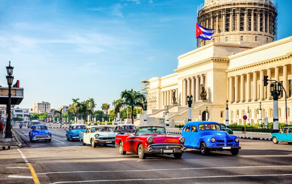 vintage cars in front of capitolio in la habana cuba