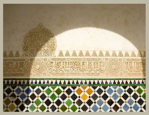 detailed tilework and plasterwork at the alhambra in granada, spain
