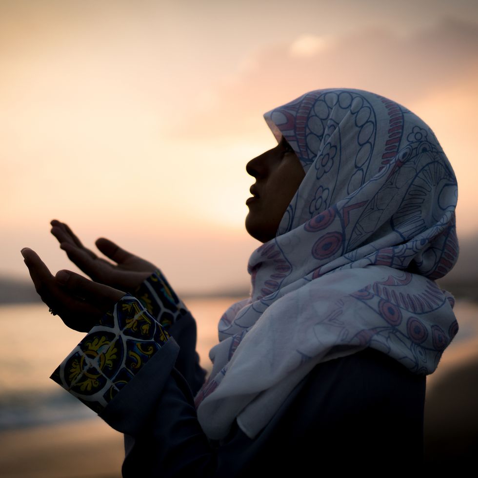 what is ramadan muslim woman at sunset on beach