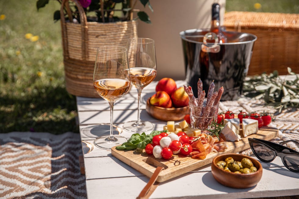 best food pairings for rose wine with antipasti picnic food snacks on sunny garden party table