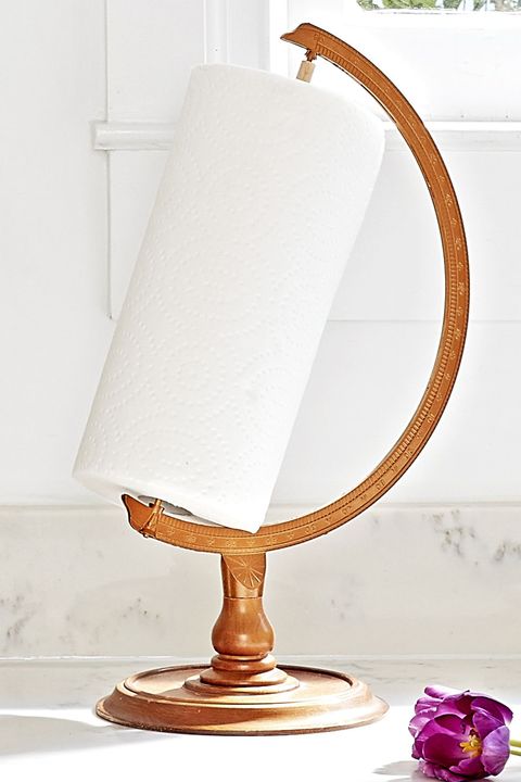 A vintage globe stand repurposed as a paper towel holder