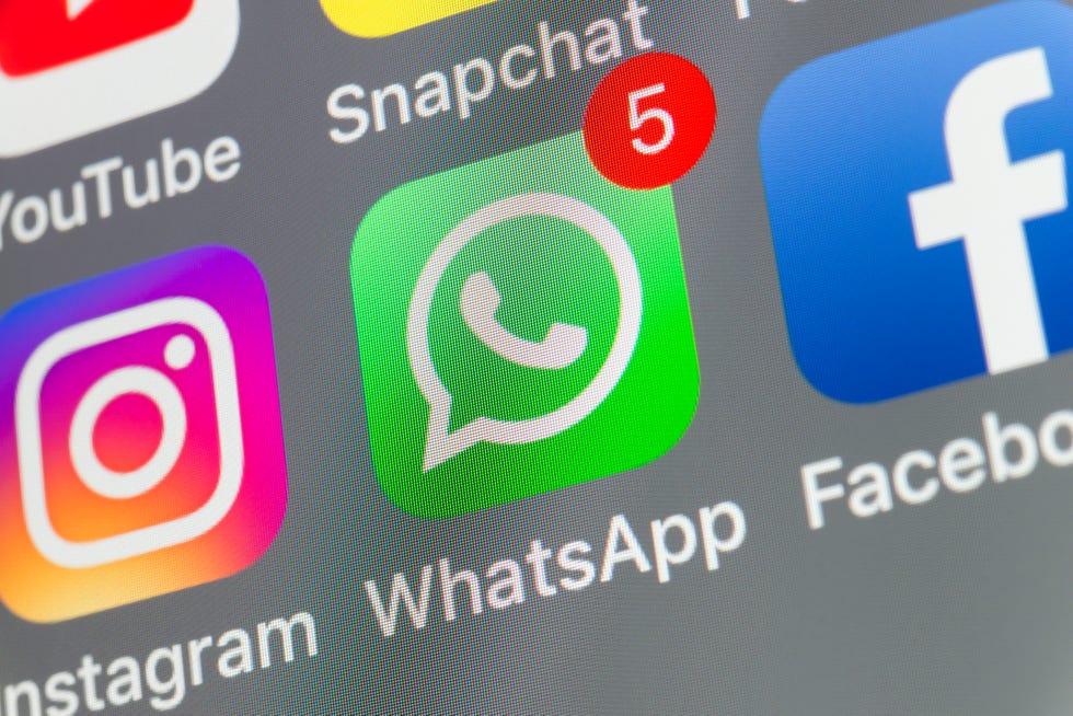 london, uk august 02, 2018: the buttons of whatsapp, facebook, instagram, snapchat and youtube on the screen of an iphone.