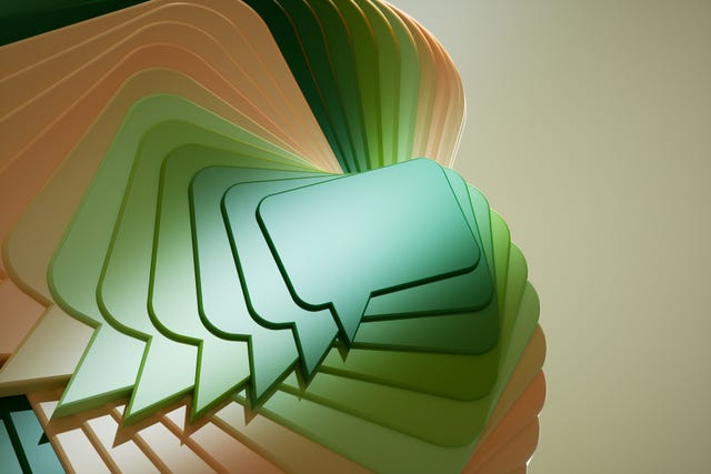 digital generated image of abstract multicoloured pop up message chat icons against beigebackground. artificial intelligence chatbot communication concept.