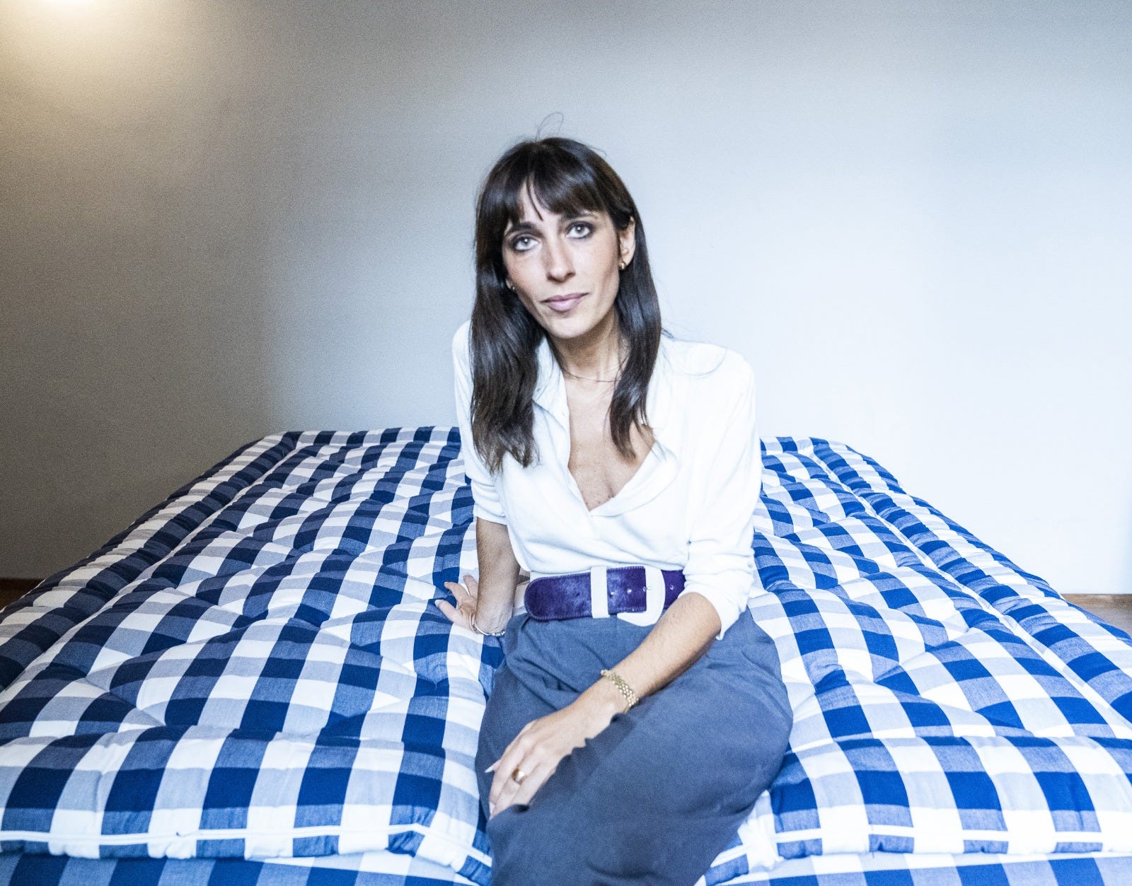 Blue, Beauty, Plaid, Textile, Sitting, Bed sheet, Bed, Room, Bedding, Leg, 