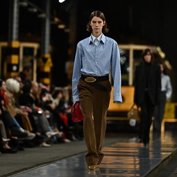 a man walking down a runway