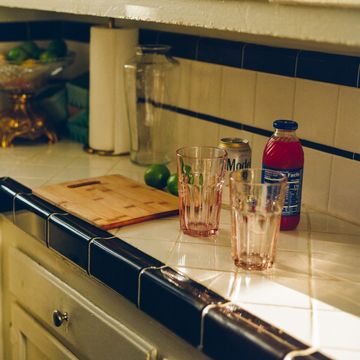 a kitchen counter with various objects on it