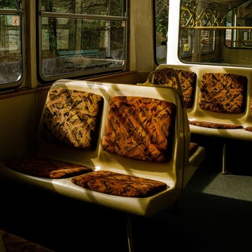 a bus with a couple of pizzas on the seats