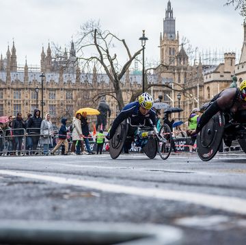 wheelchair athletes seen crossing the parliament square
