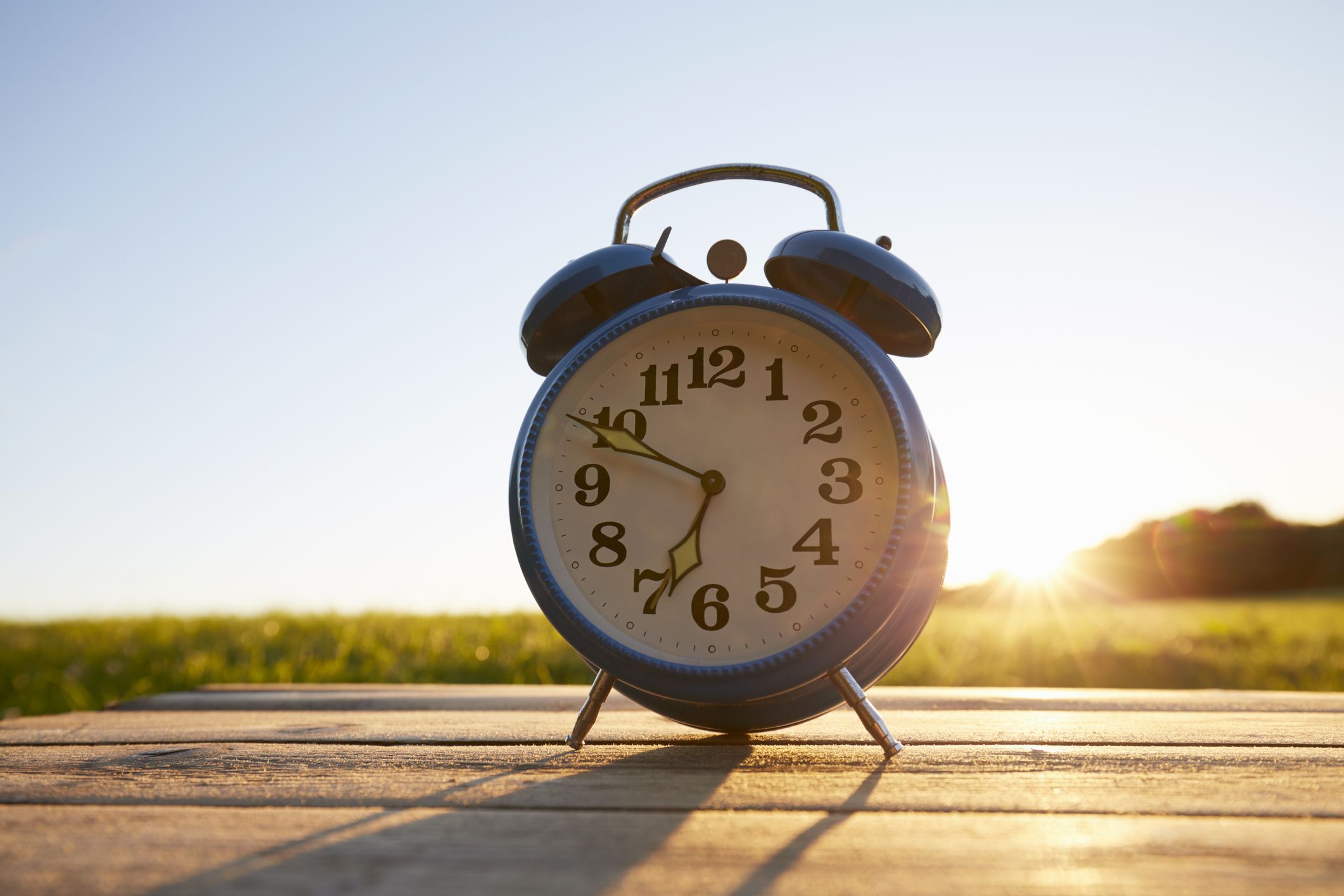 June 12nd. Day 12 Of Month, Calendar Date. White Alarm Clock On Red  Background With Calendar Date. Concept Of Time, Deadline, Time To Work,  Morning. Summer Month, Day Of The Year Concept