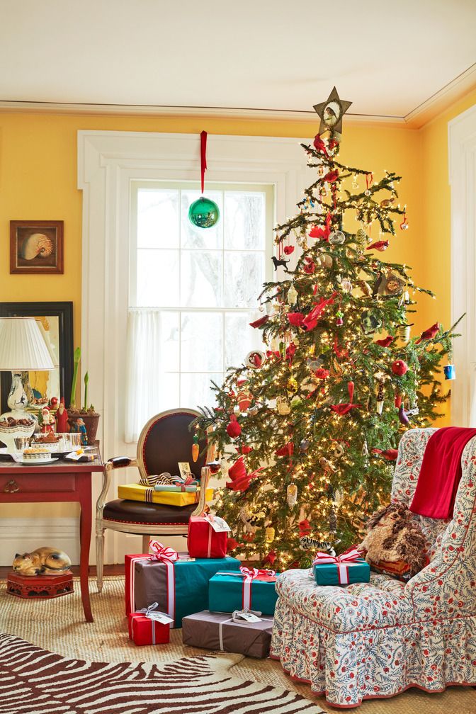 a christmas tree in a yellow living room