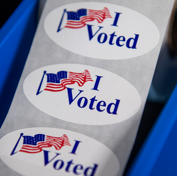 a roll of 'i voted' stickers in black and white