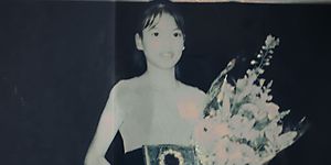 jennifer pan as a child holding an award and flowers