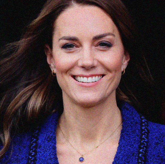 kate middleton smiles in front of a black background