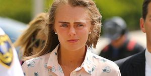michelle carter, a blonde woman with straight brown eyebrows and wearing a pink shirt, arrives to hear the verdict of her trial, she was later charged with involuntary manslaughter for encouraging 18 year old conrad roy to kill himself