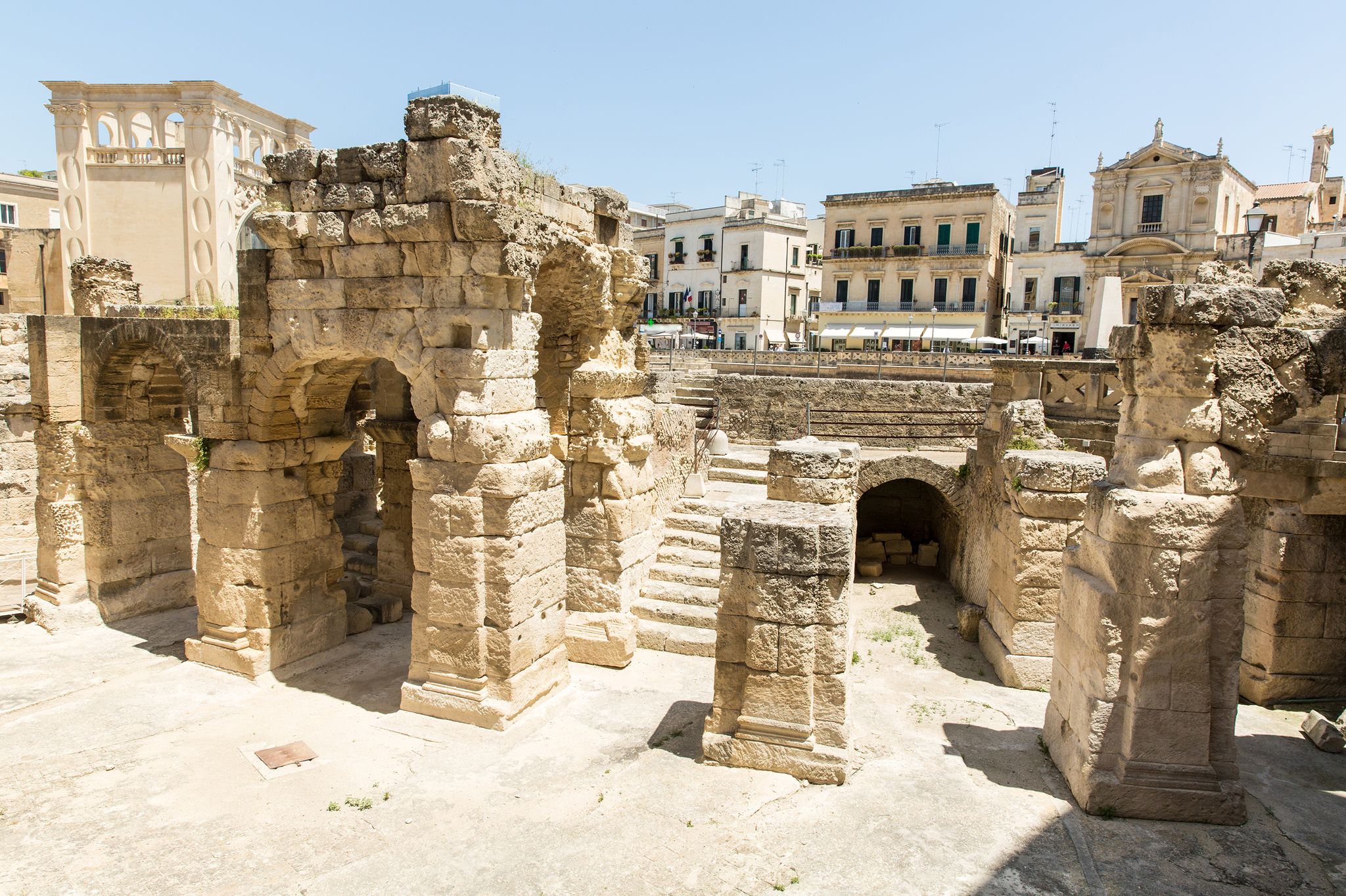 the ruins of lecce's ancient roman amphitheatre, puglia, italy