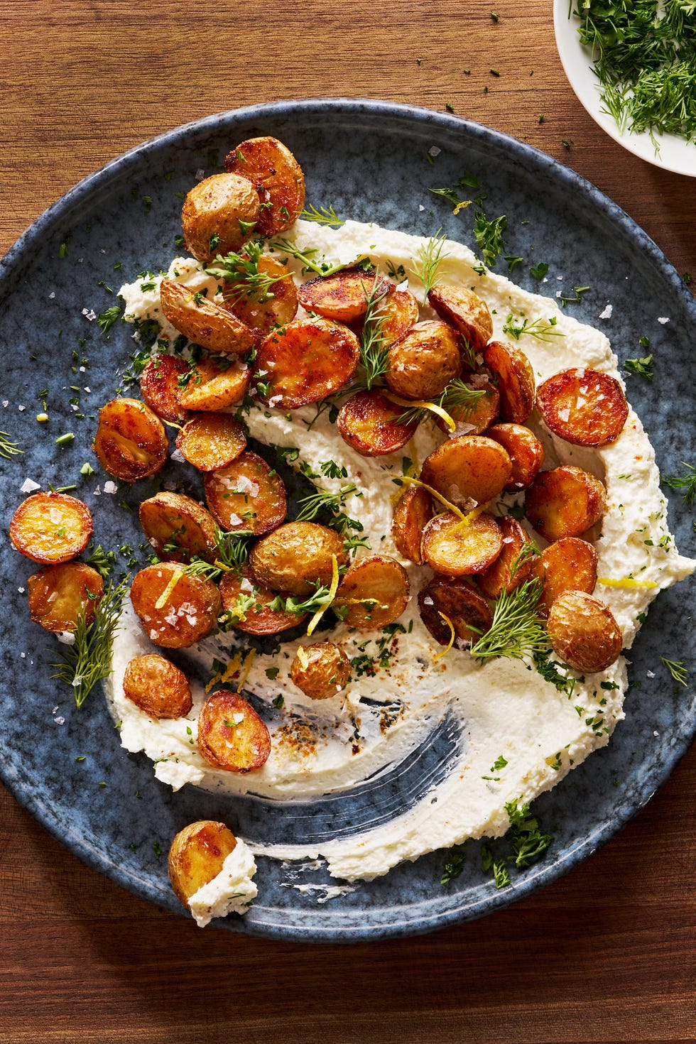 Whipped feta cheese topped with crispy roasted potatoes