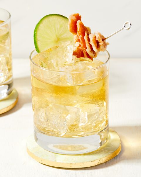 whiskey ginger garnished with candied ginger and a lime wheel