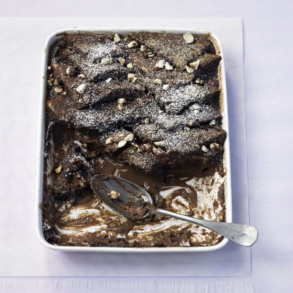 whisky bread and butter pudding with chocolate and toasted hazelnuts
