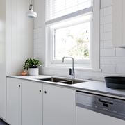 White and charcoal new renovated galley style Australian kitchen
