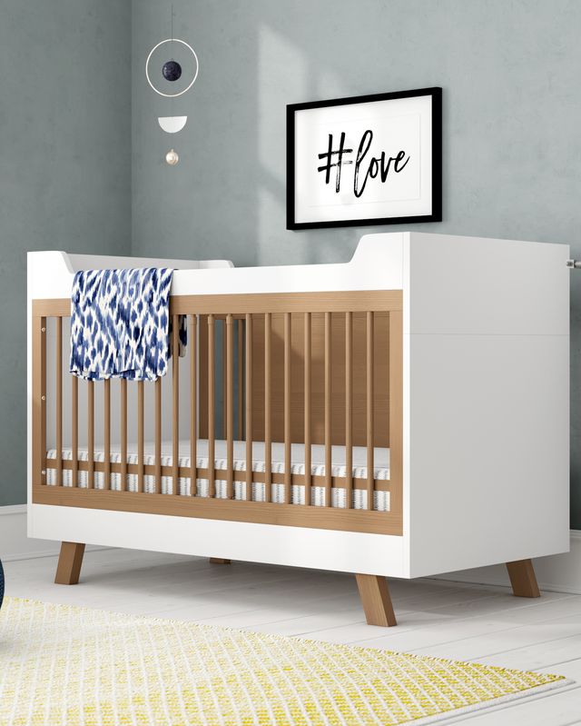 White and wooden cot