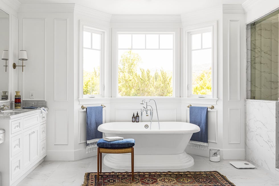 white bathroom with freestanding tub